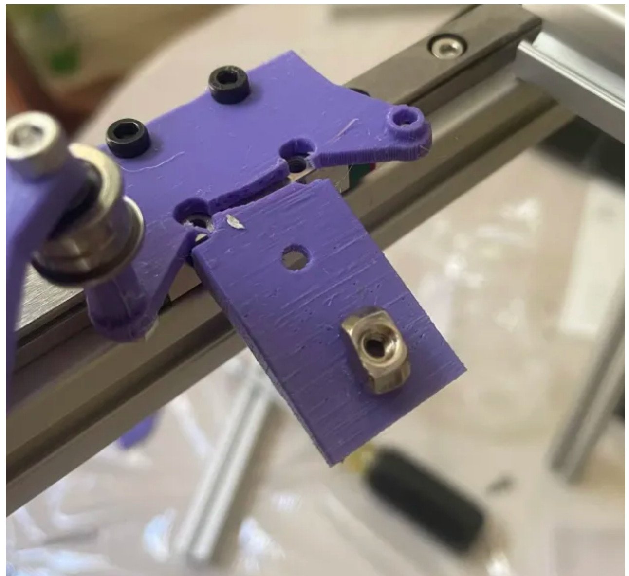 Broken printed plastic parts from an early CoreXY mock-up