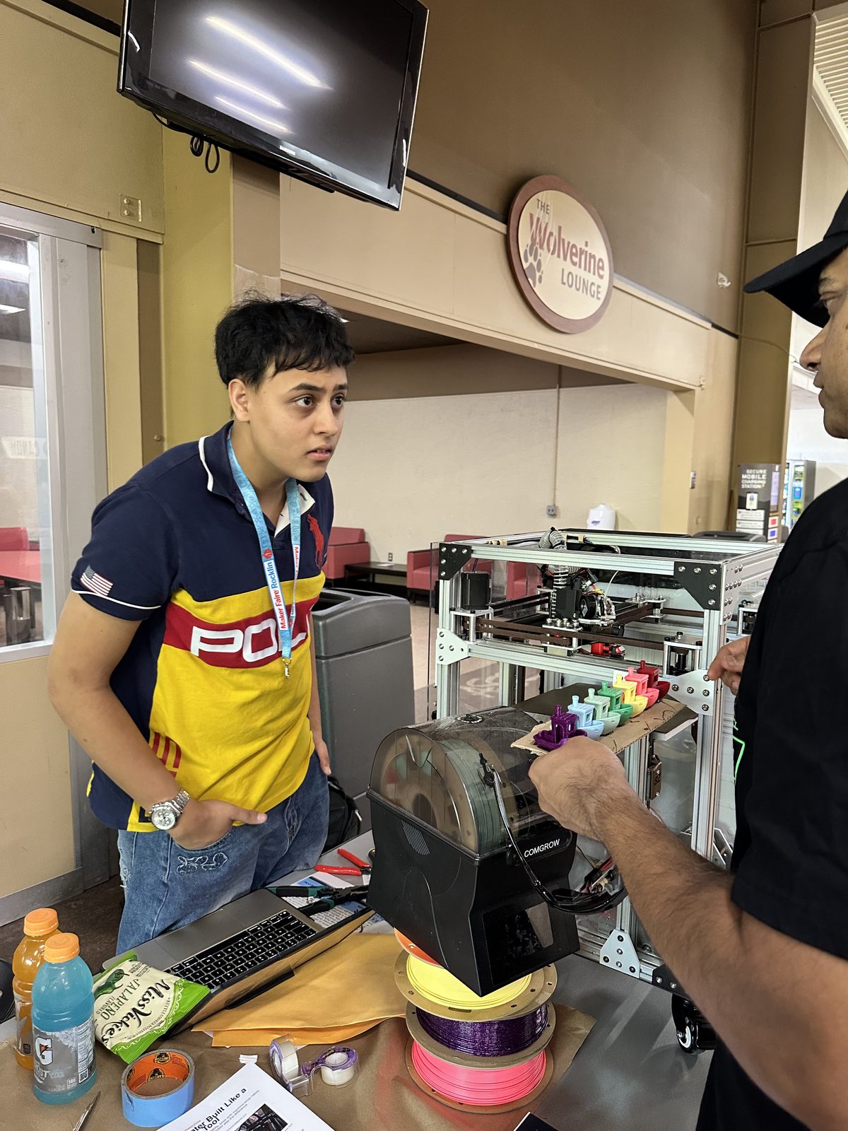 Me showing the Boaz printer to a visitor at Maker Faire Rocklin
