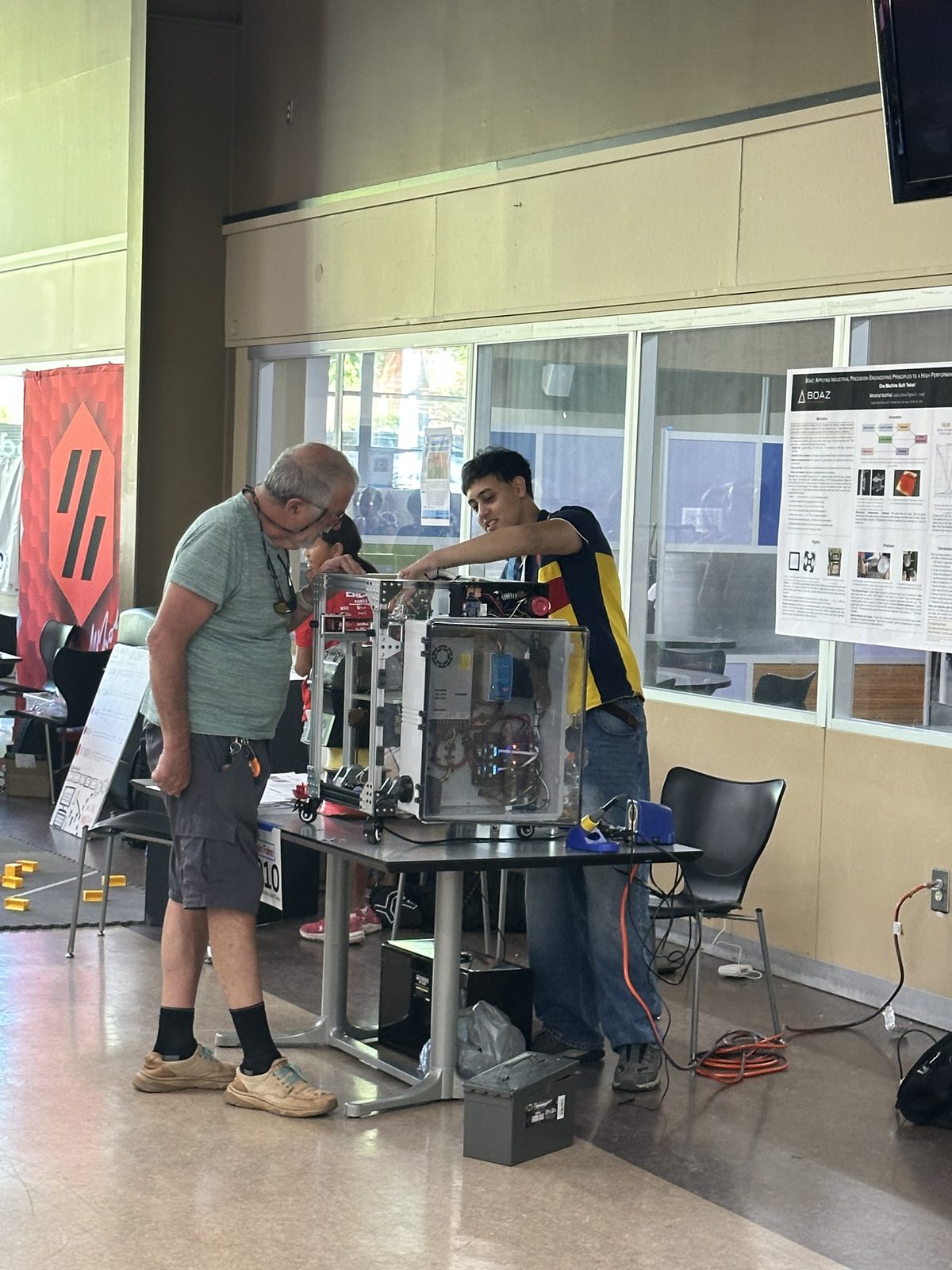 Me showing the Boaz printer to a visitor at Maker Faire Rocklin