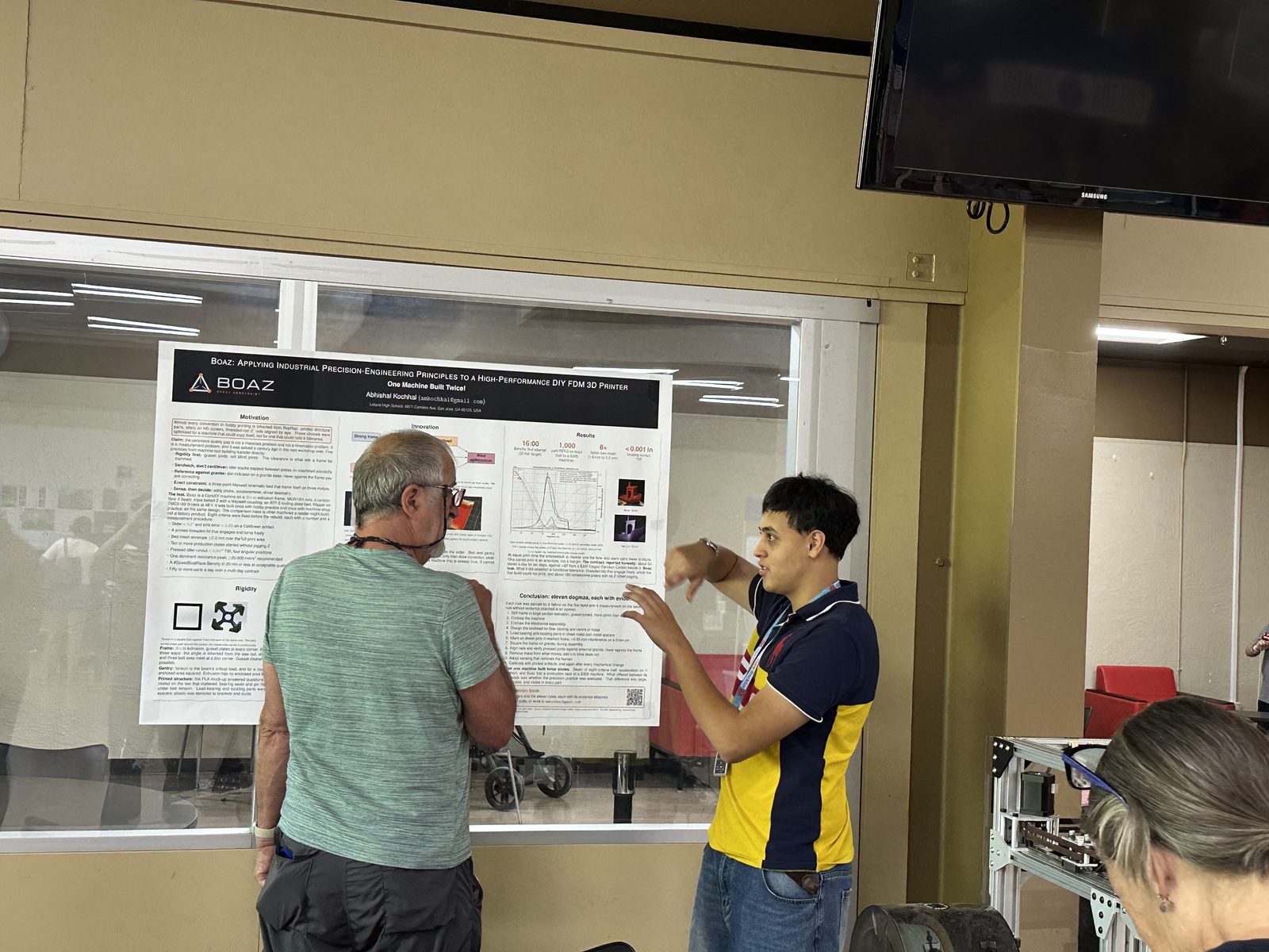 Me explaining the Boaz poster to a visitor