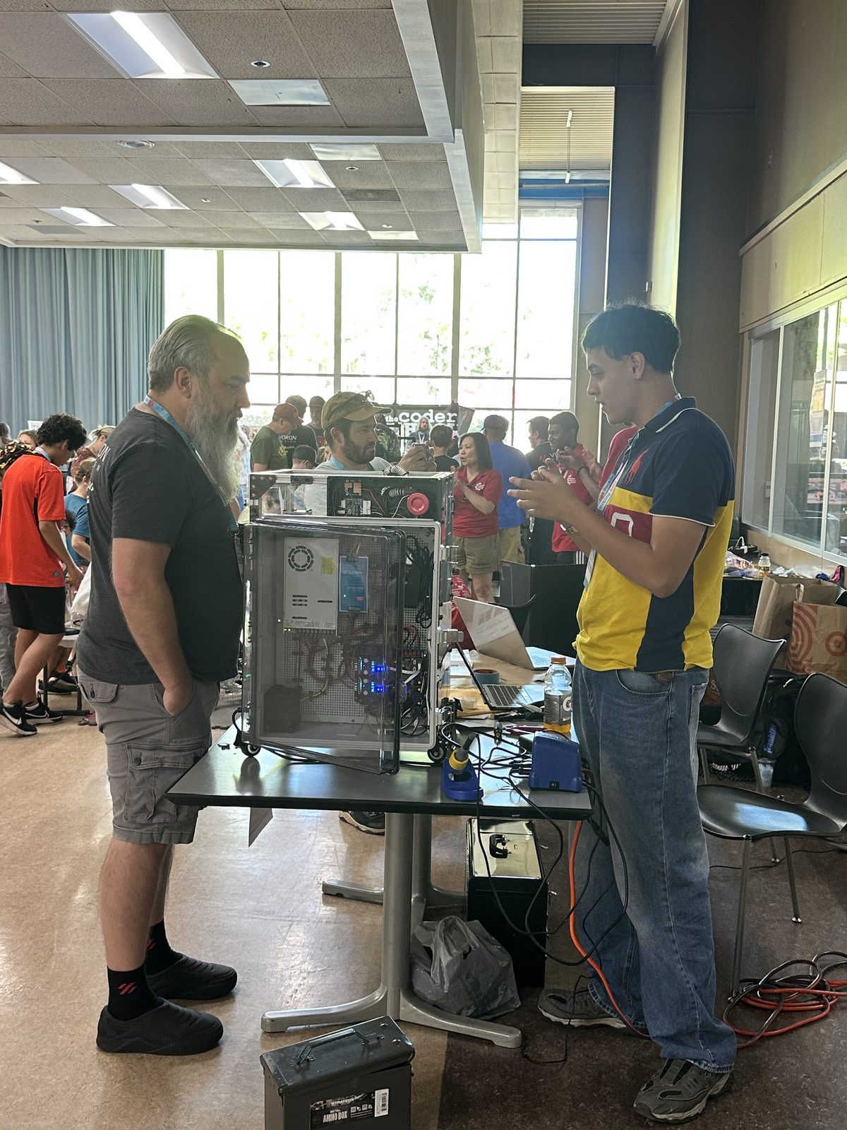 Me showing the Boaz printer to a visitor at Maker Faire Rocklin