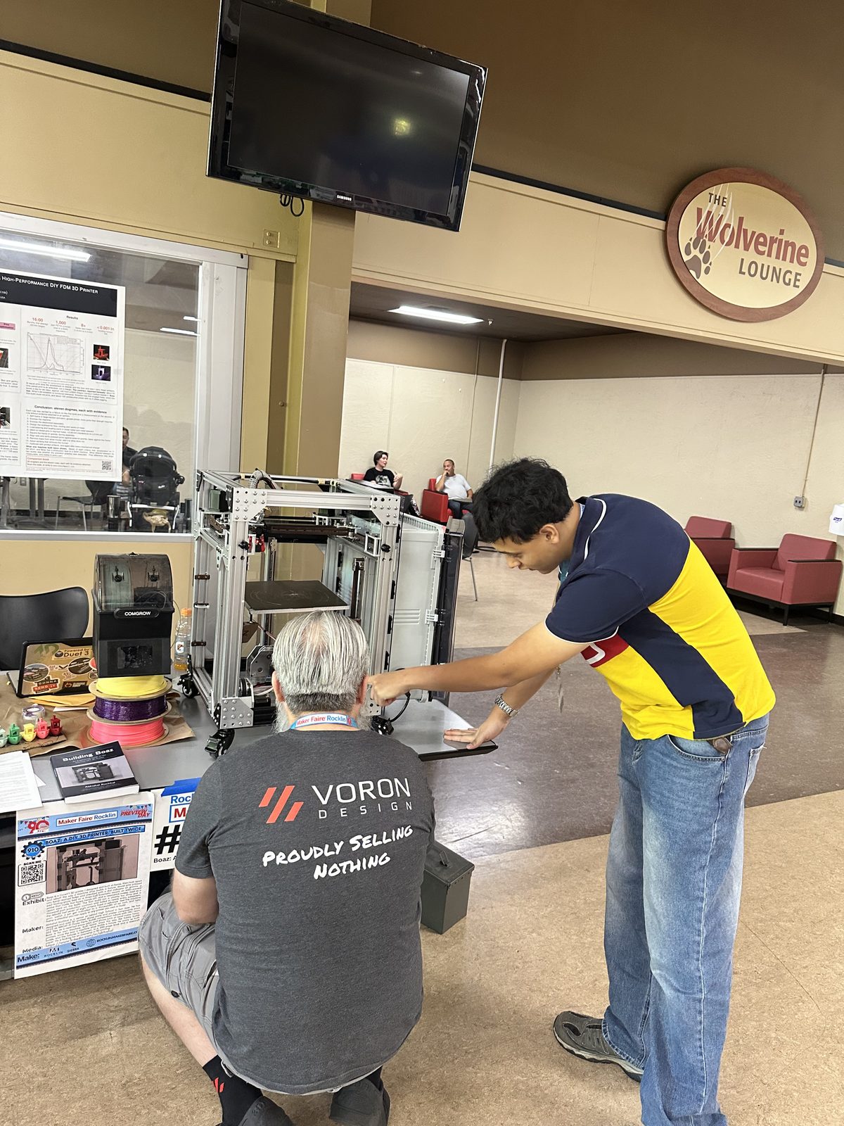 Me showing the Boaz printer to a visitor at Maker Faire Rocklin