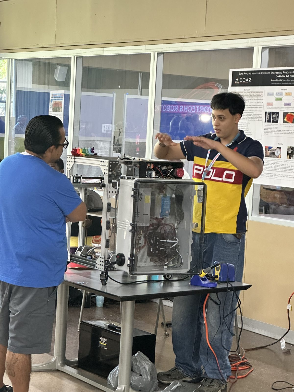 Me showing the Boaz printer to a visitor at Maker Faire Rocklin